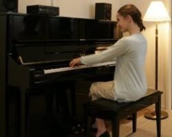 a girl practicing piano